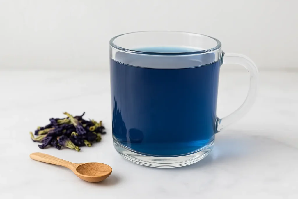 Steeped butterfly pea tea in a glass mug for Brazilian Mounjaro recipe